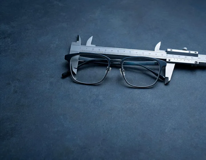 Custom prescription glasses frames prepared for size checks, illustration only